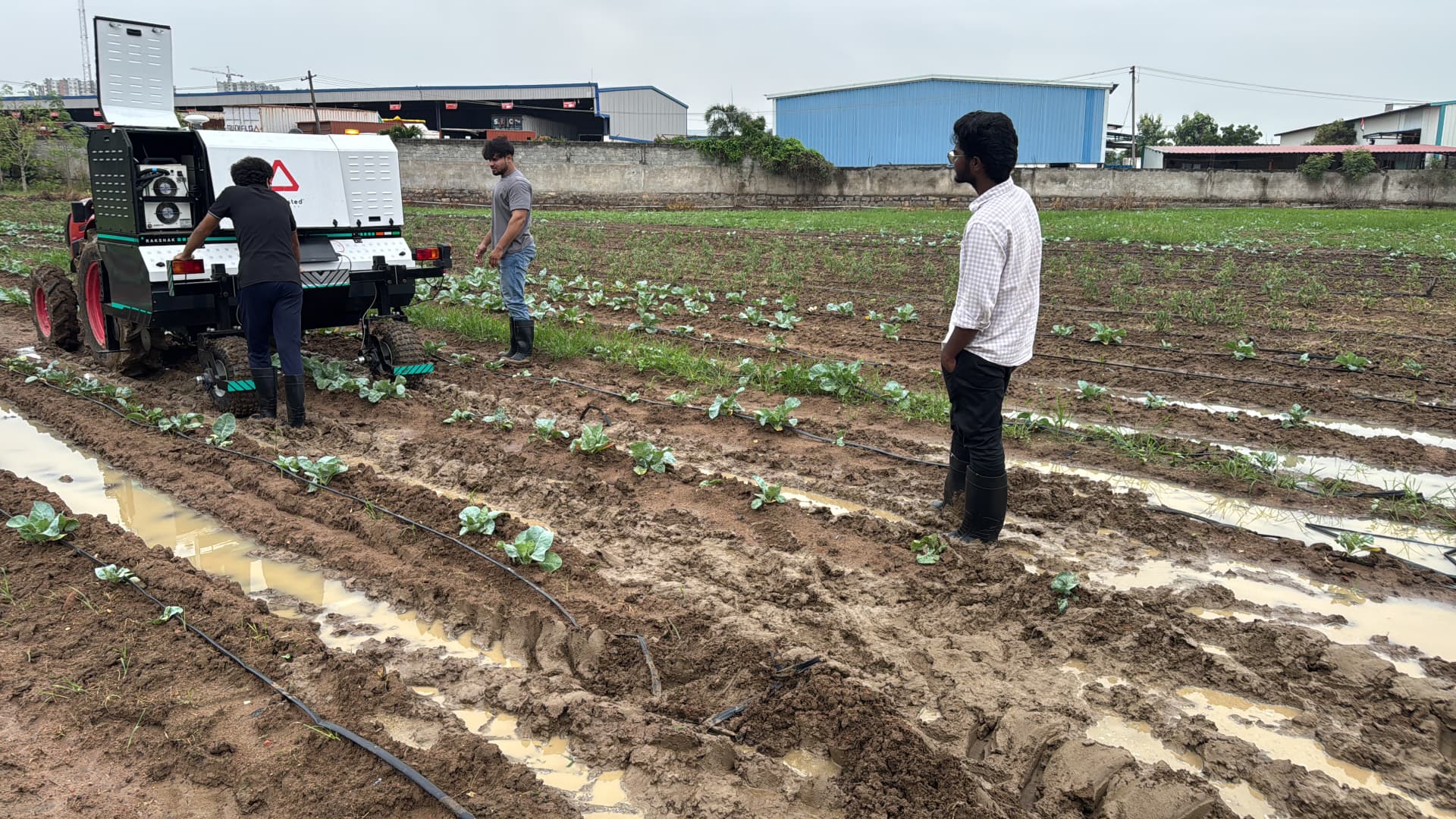 Field testing Rakshakh in a wet, muddy paddy field